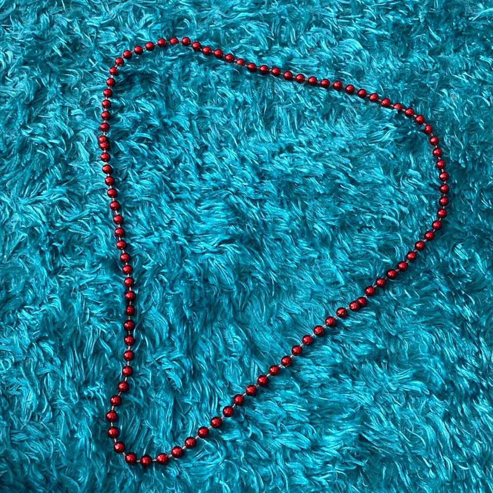 Red plastic spherical beads necklace